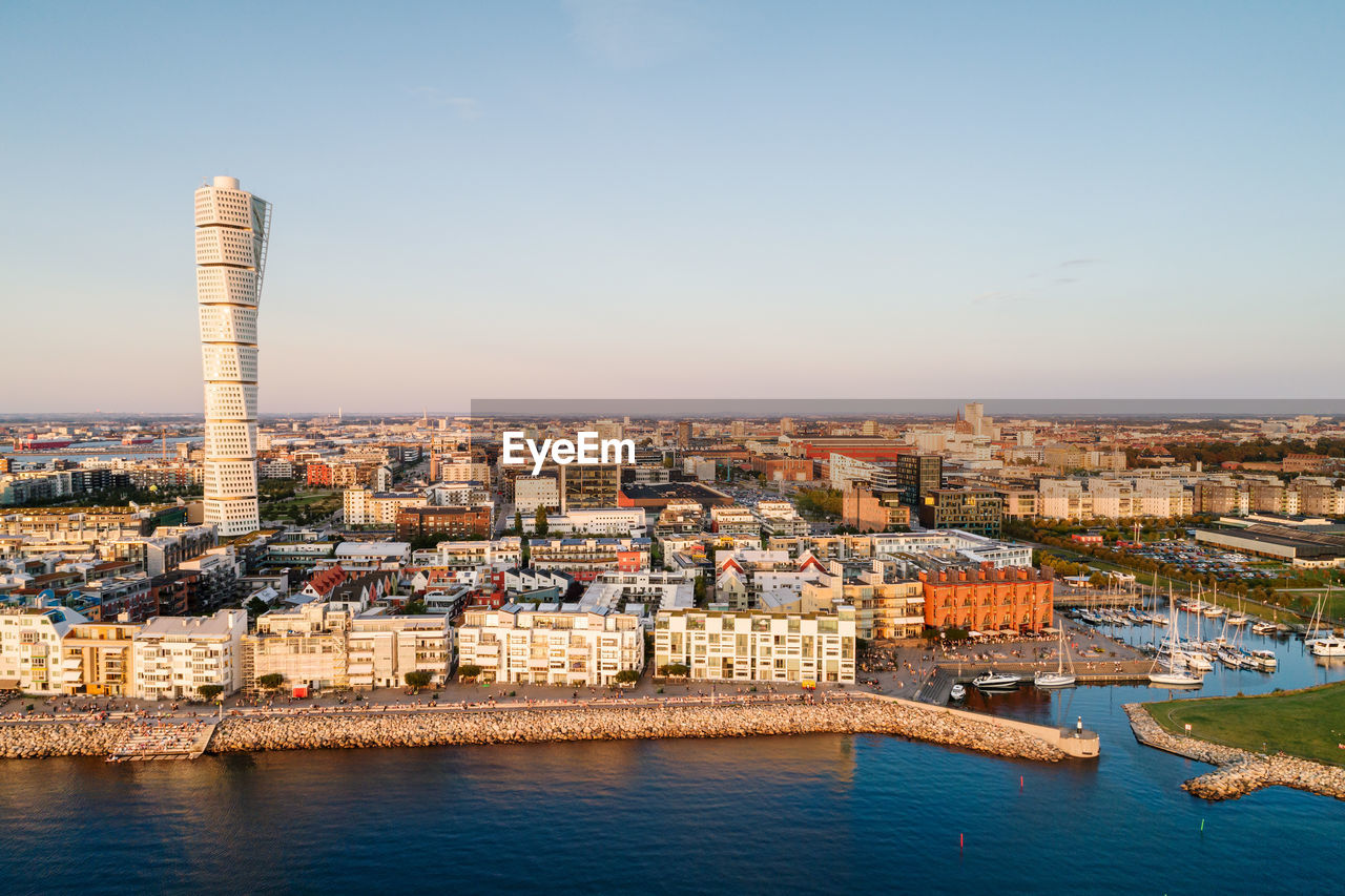 Scenic view of modern skyline in malmo city against clear sky