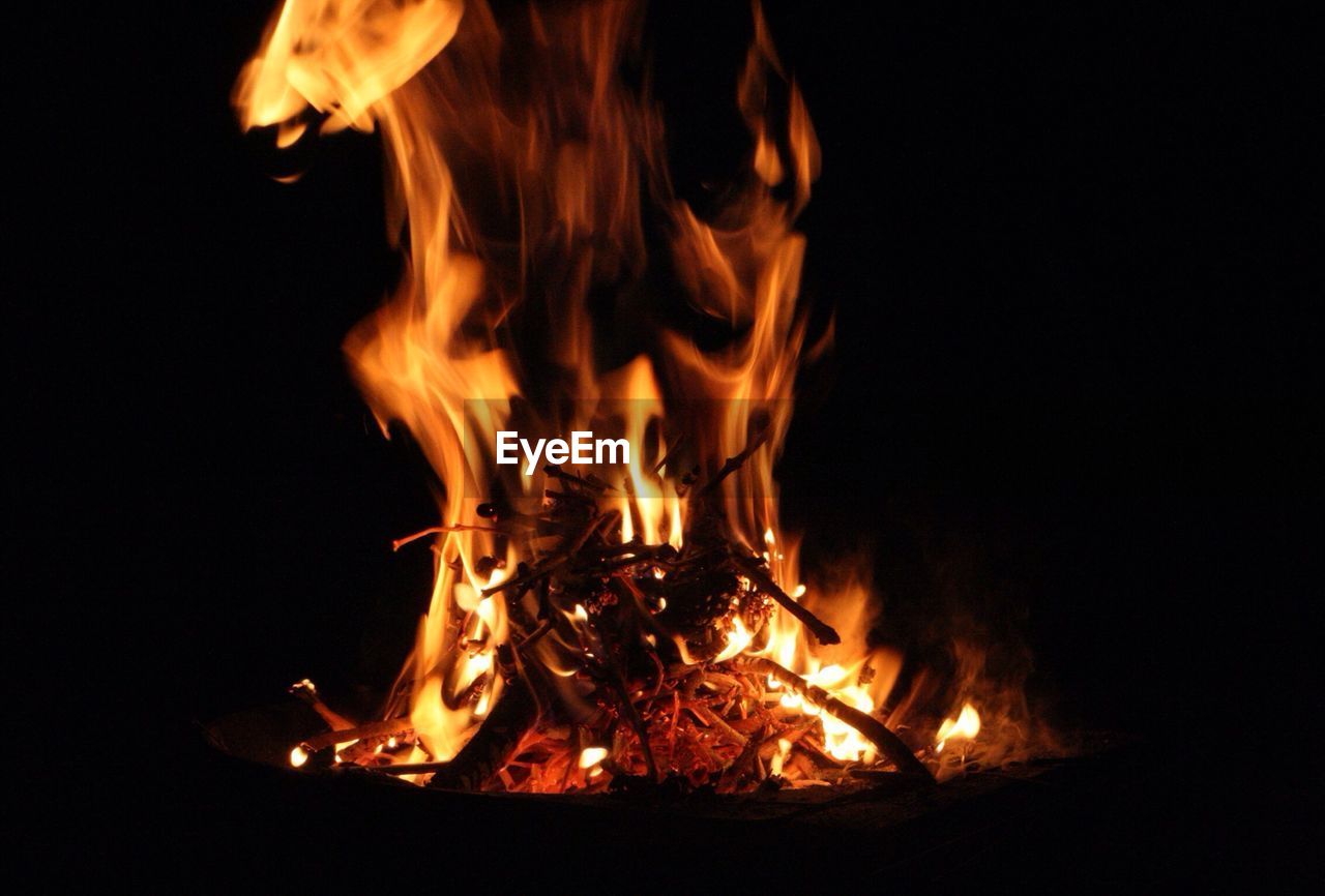 CLOSE-UP OF BONFIRE IN THE DARK