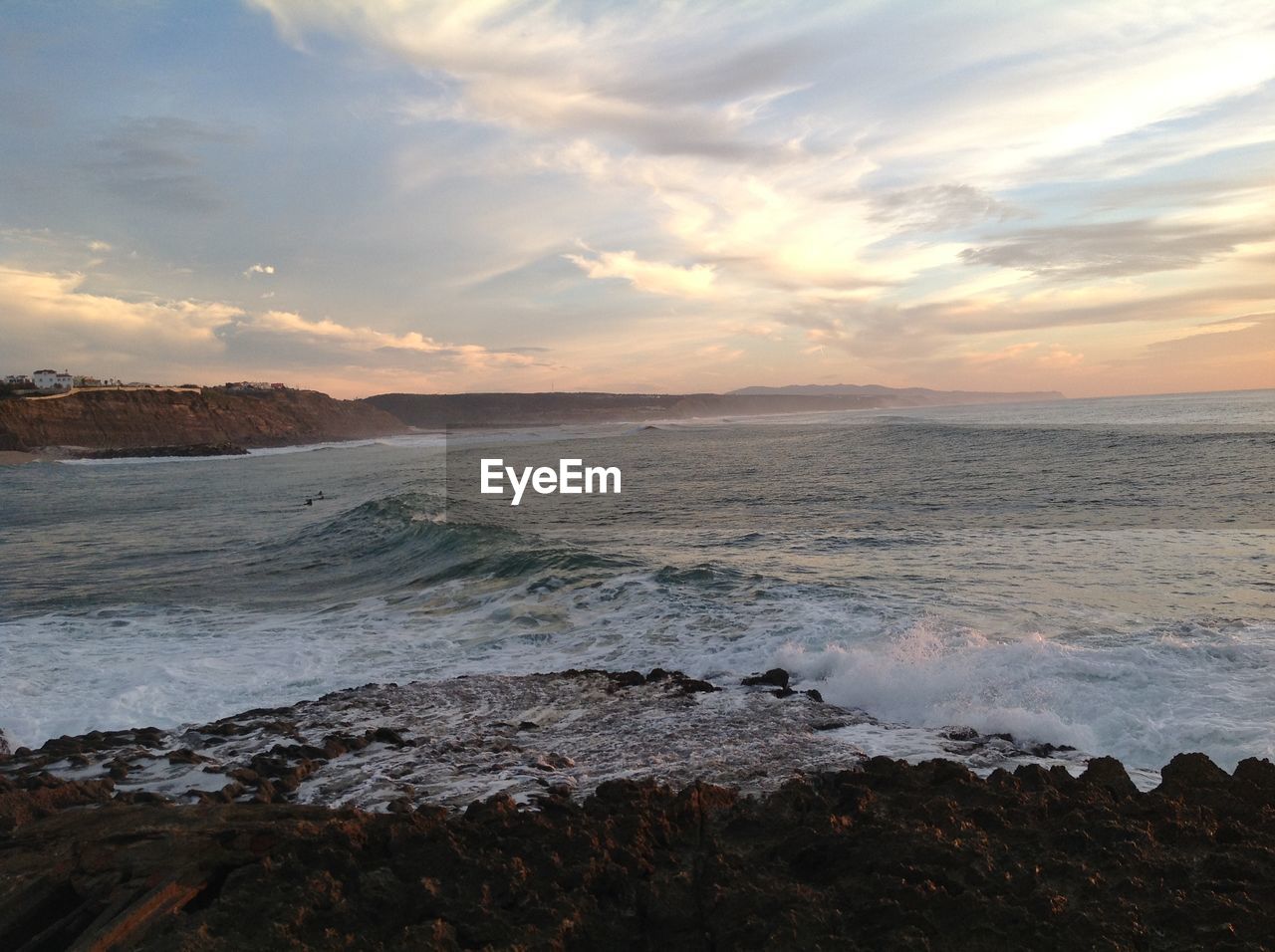 Scenic view of sea against dramatic sky