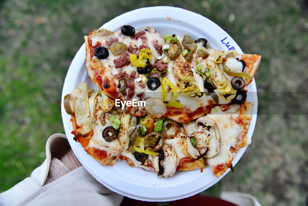 High angle view of pizza served on table