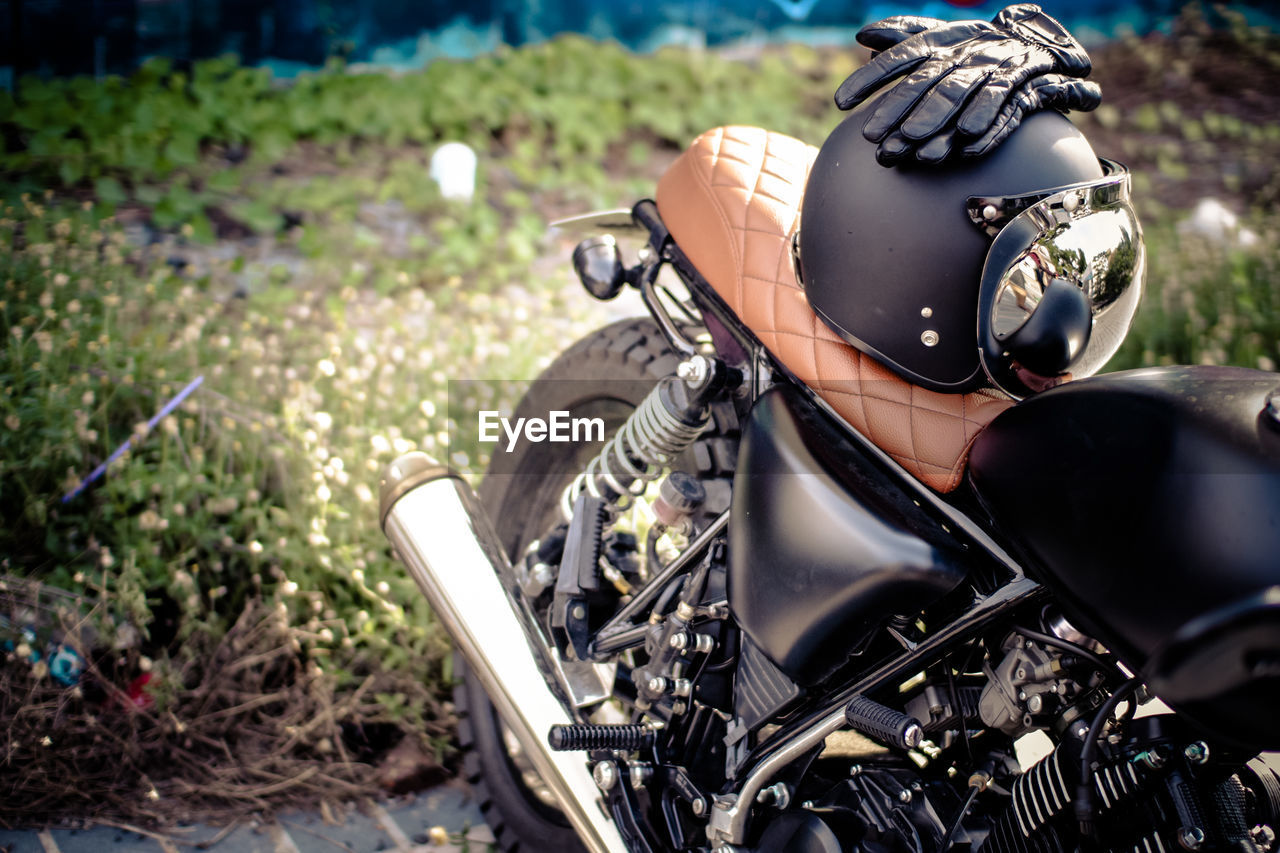 Helmet and gloves on motorcycle