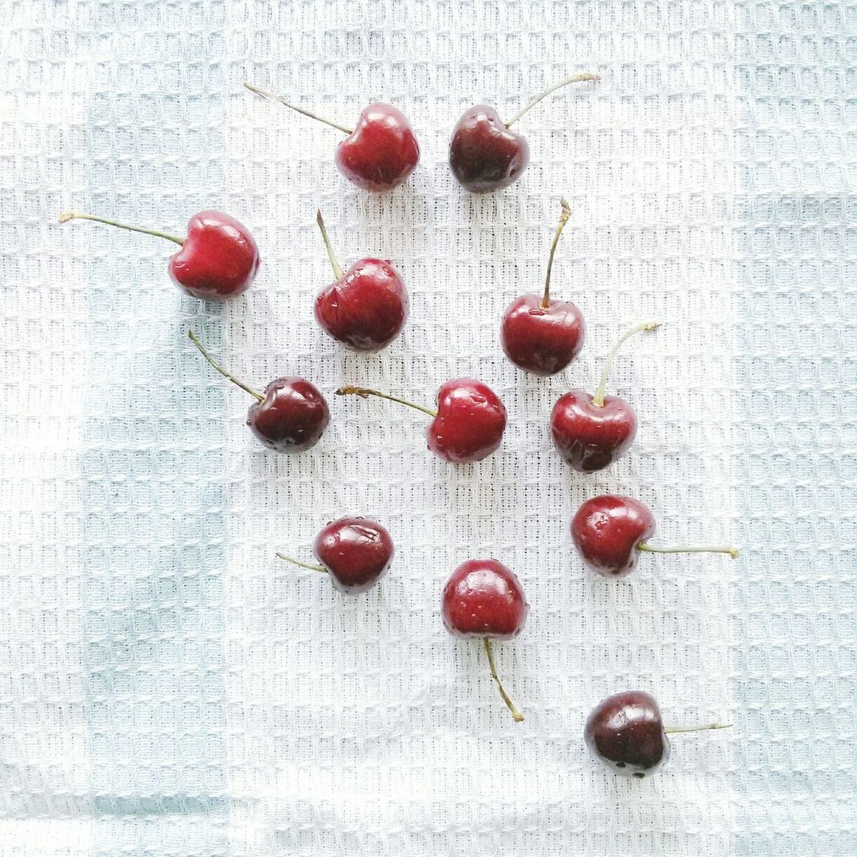 Overhead view of cherries on table