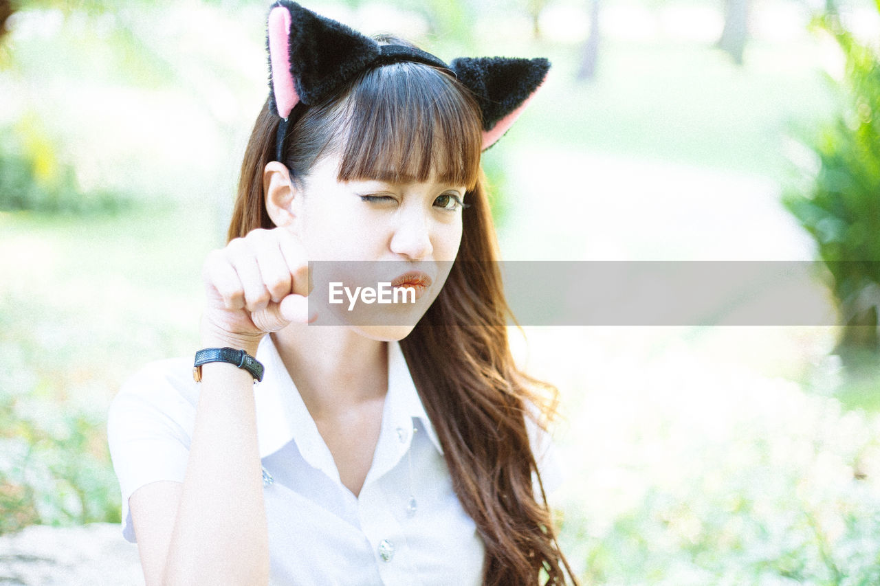 Portrait of young woman outdoors