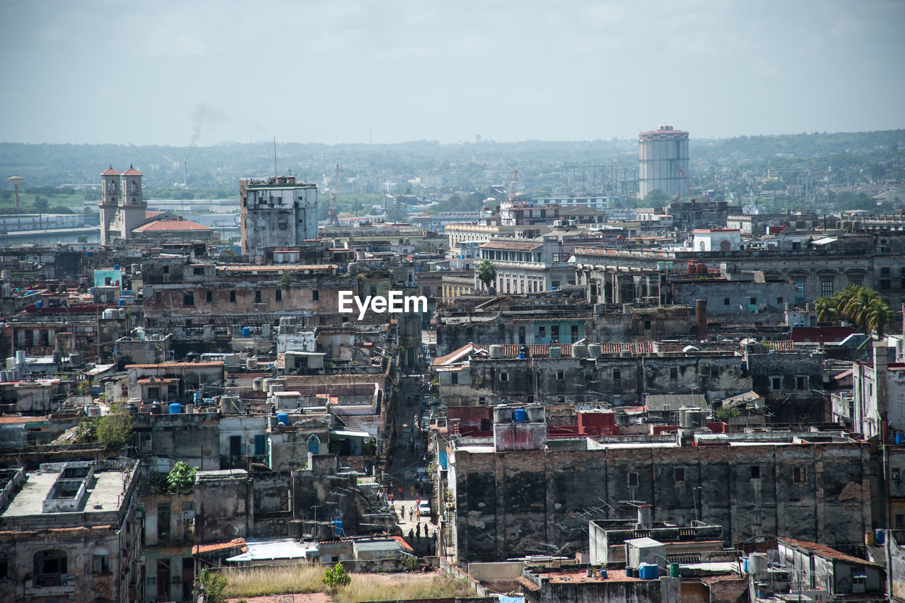 High angle view of buildings in city against sky