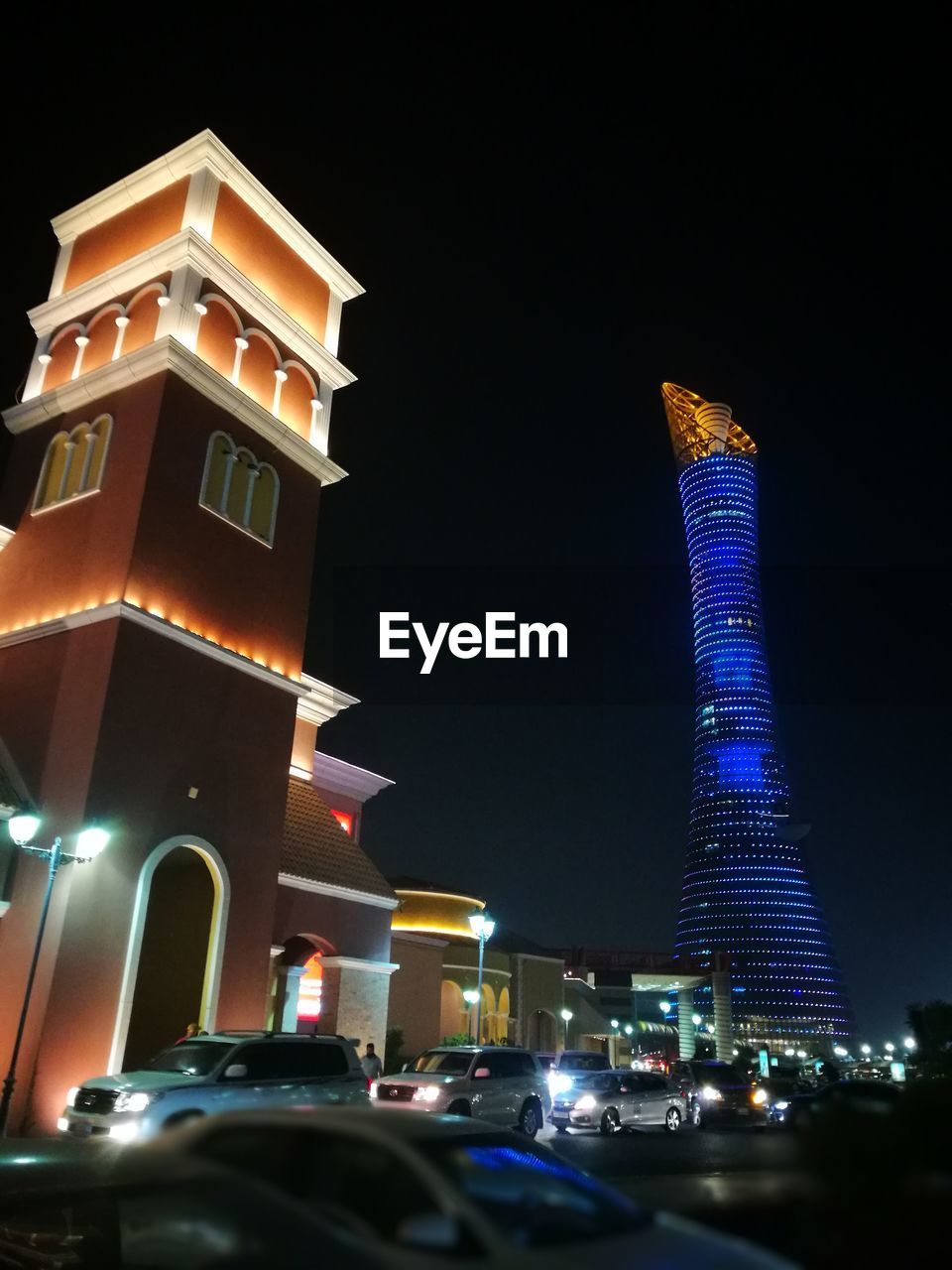 ILLUMINATED MODERN BUILDING AT NIGHT