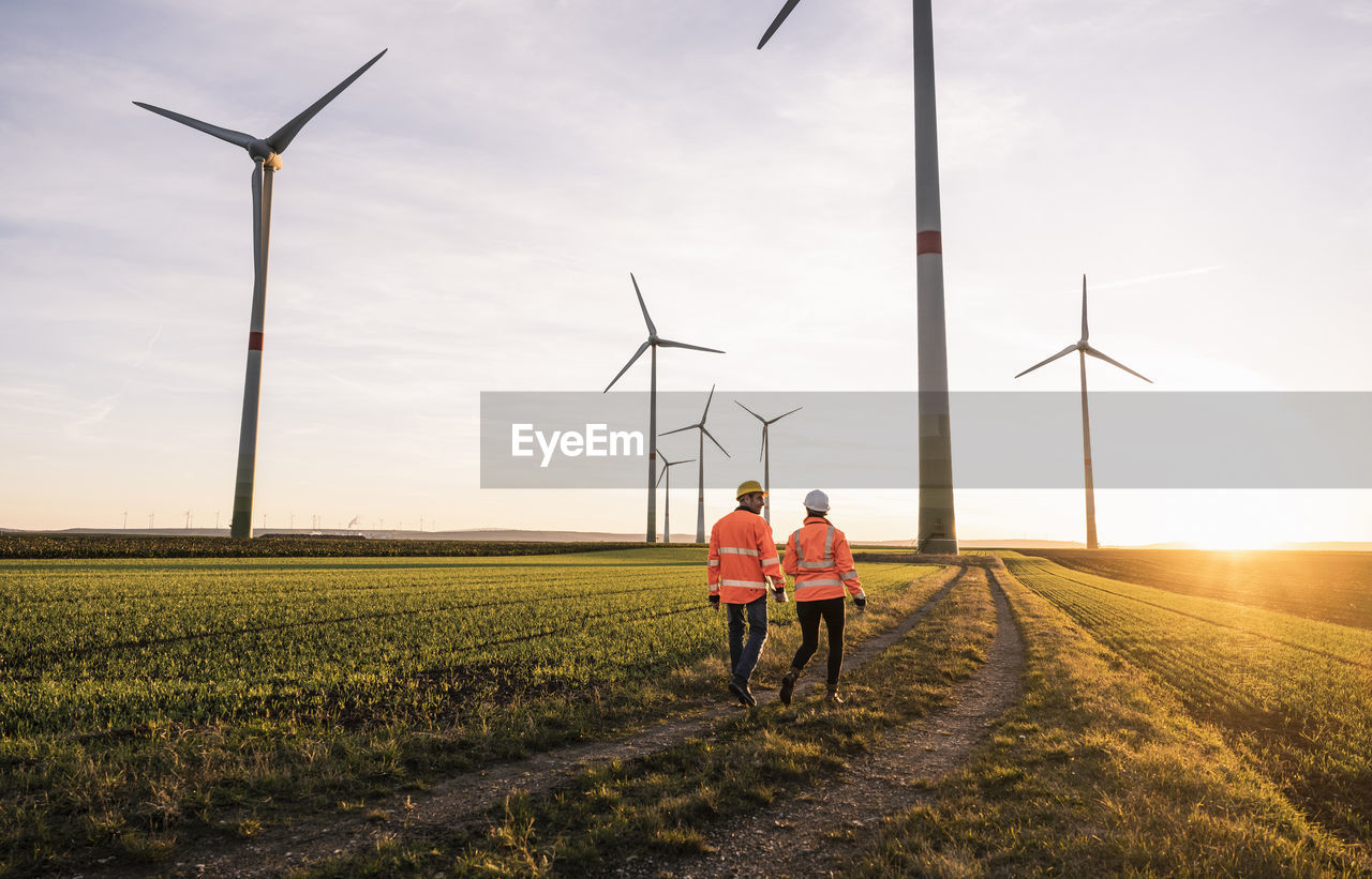 Engineers walking at wind park