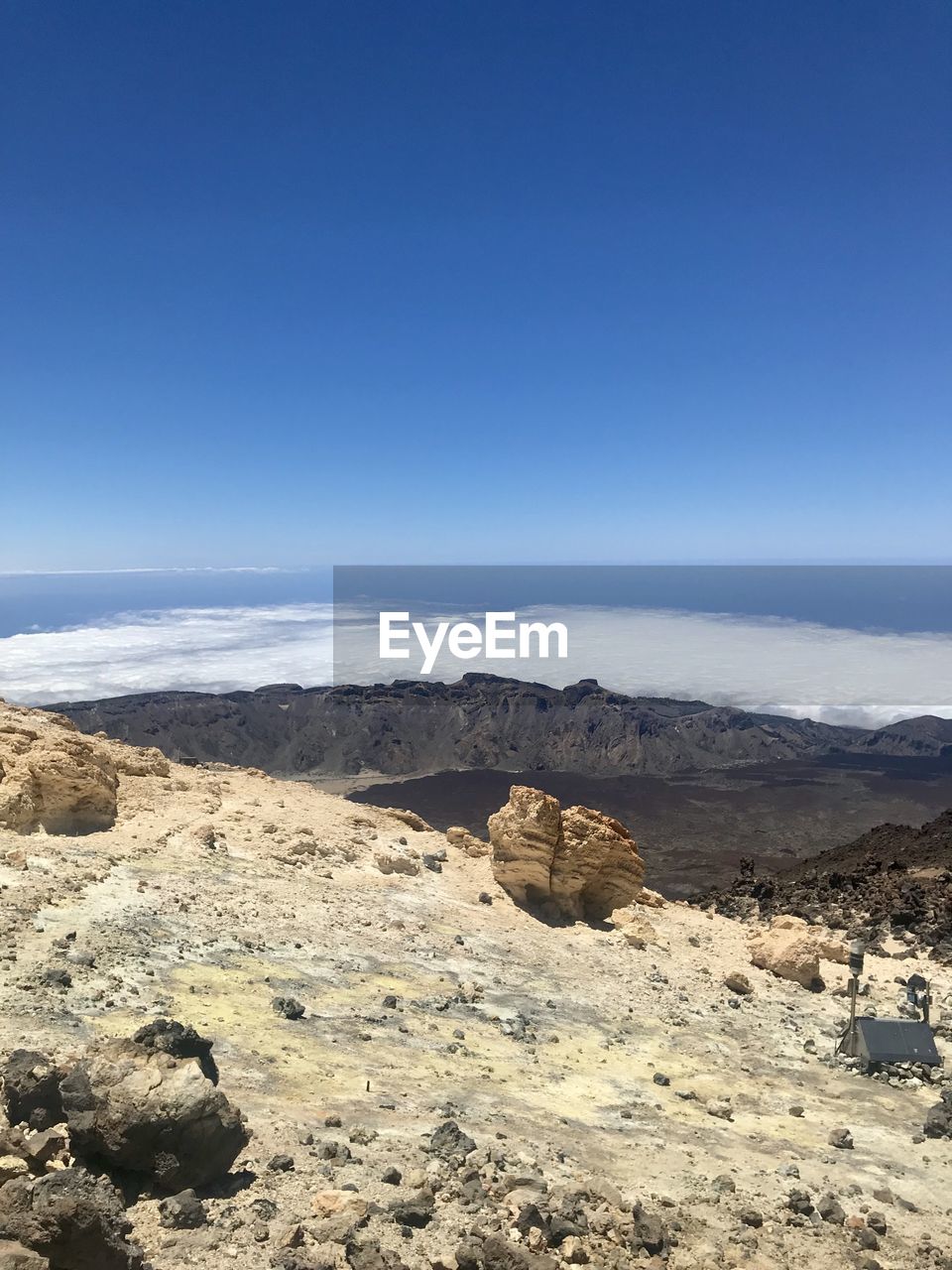 Scenic view of landscape against blue sky