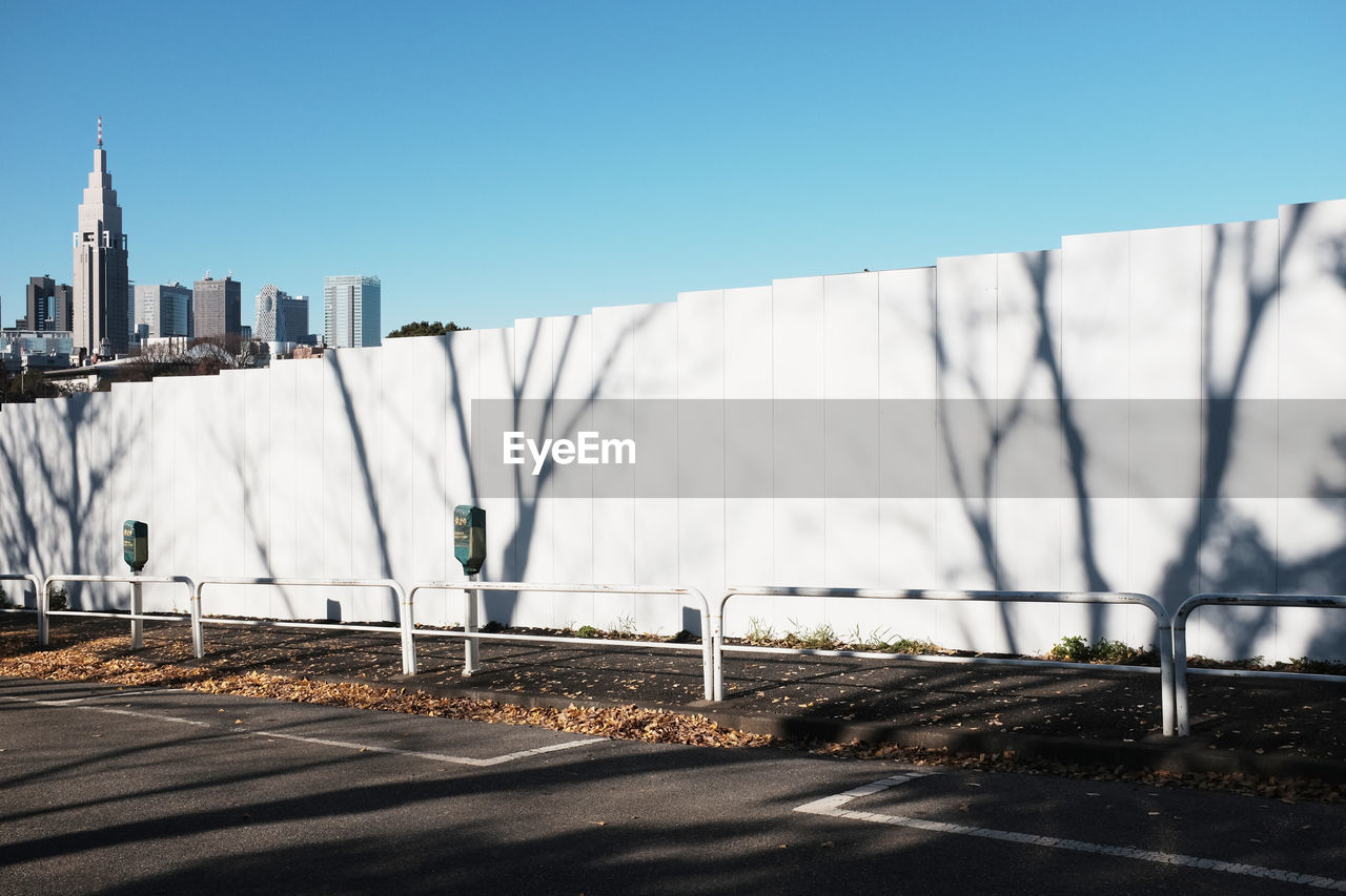 Buildings in city against clear sky