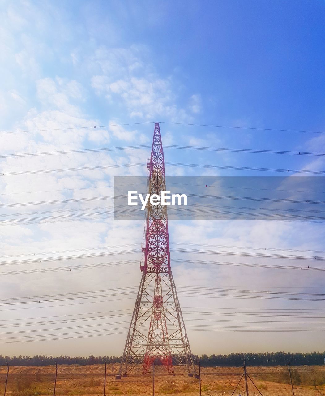 Traditional electric towers against blue clear sky