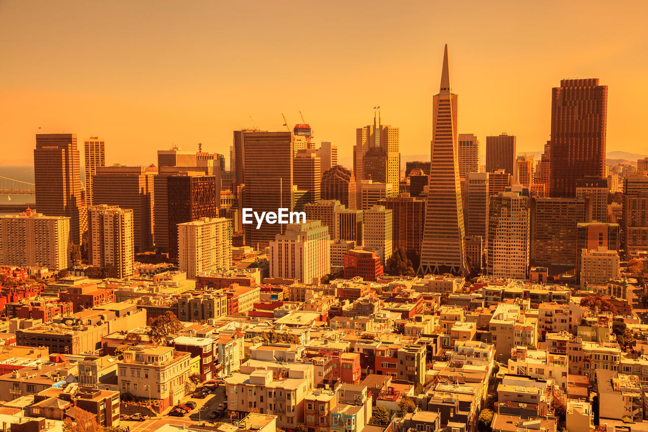 AERIAL VIEW OF MODERN BUILDINGS IN CITY AGAINST SKY