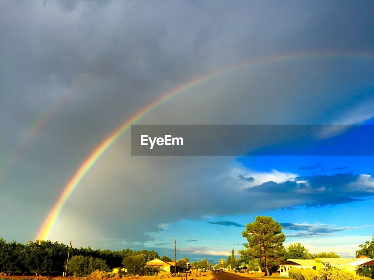 SCENIC VIEW OF RAINBOW OVER LANDSCAPE