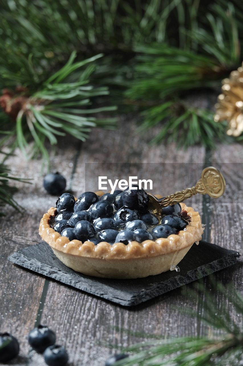 Christmas still life baked basket with blueberries and icing