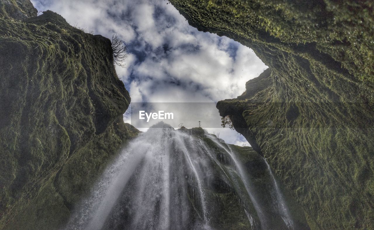 Panoramic view of waterfall against sky