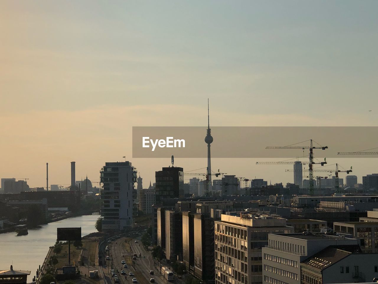 Alexanderplatz amidst city of berlin during sunset