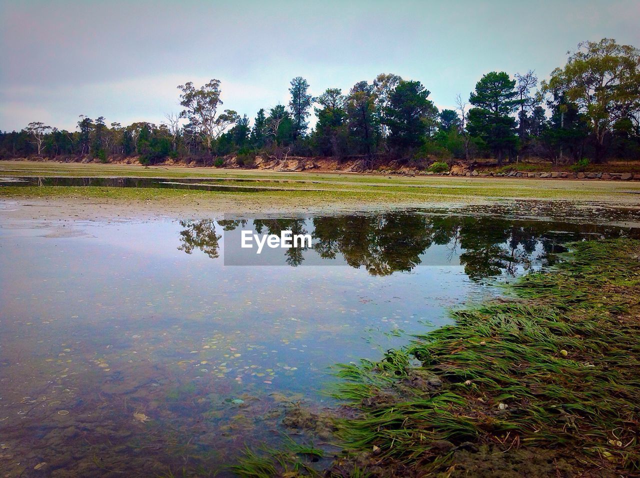 SCENIC VIEW OF CALM LAKE