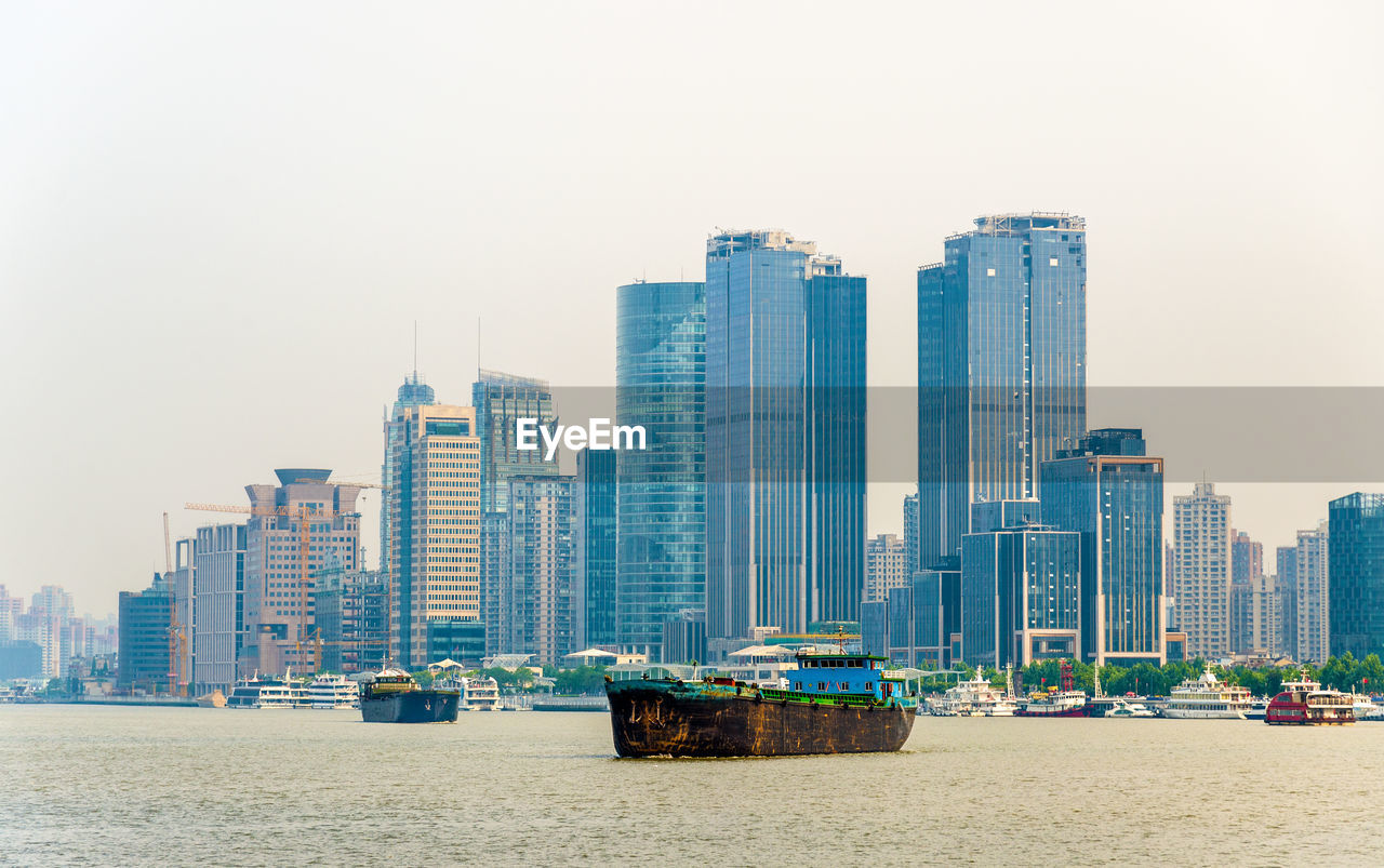 VIEW OF MODERN BUILDINGS AGAINST CLEAR SKY