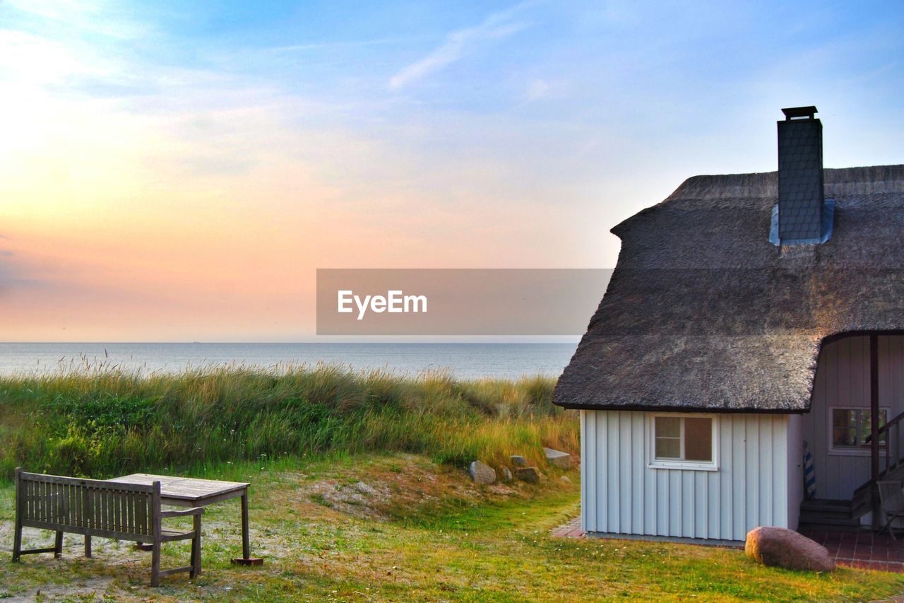 Built structure on beach against sky