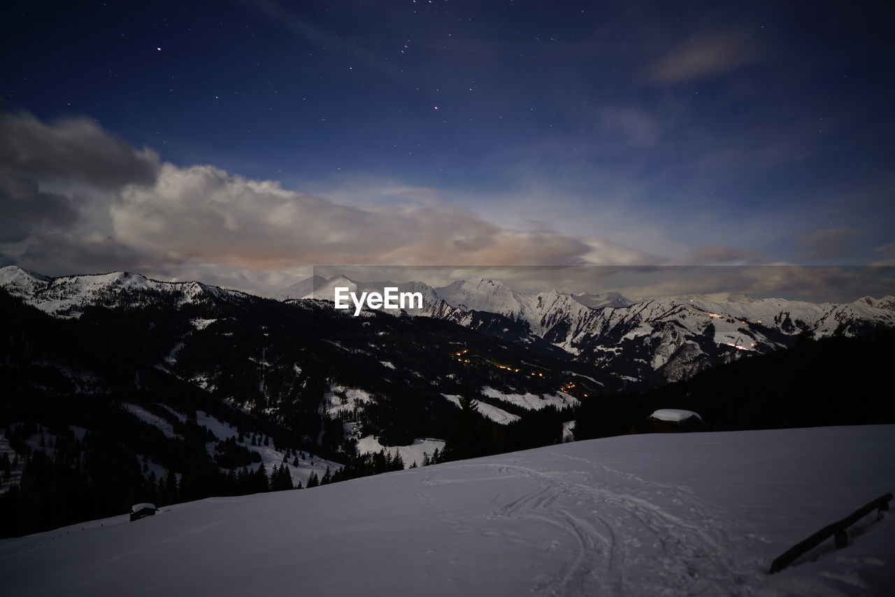 Scenic view of snowcapped mountains against sky during winter