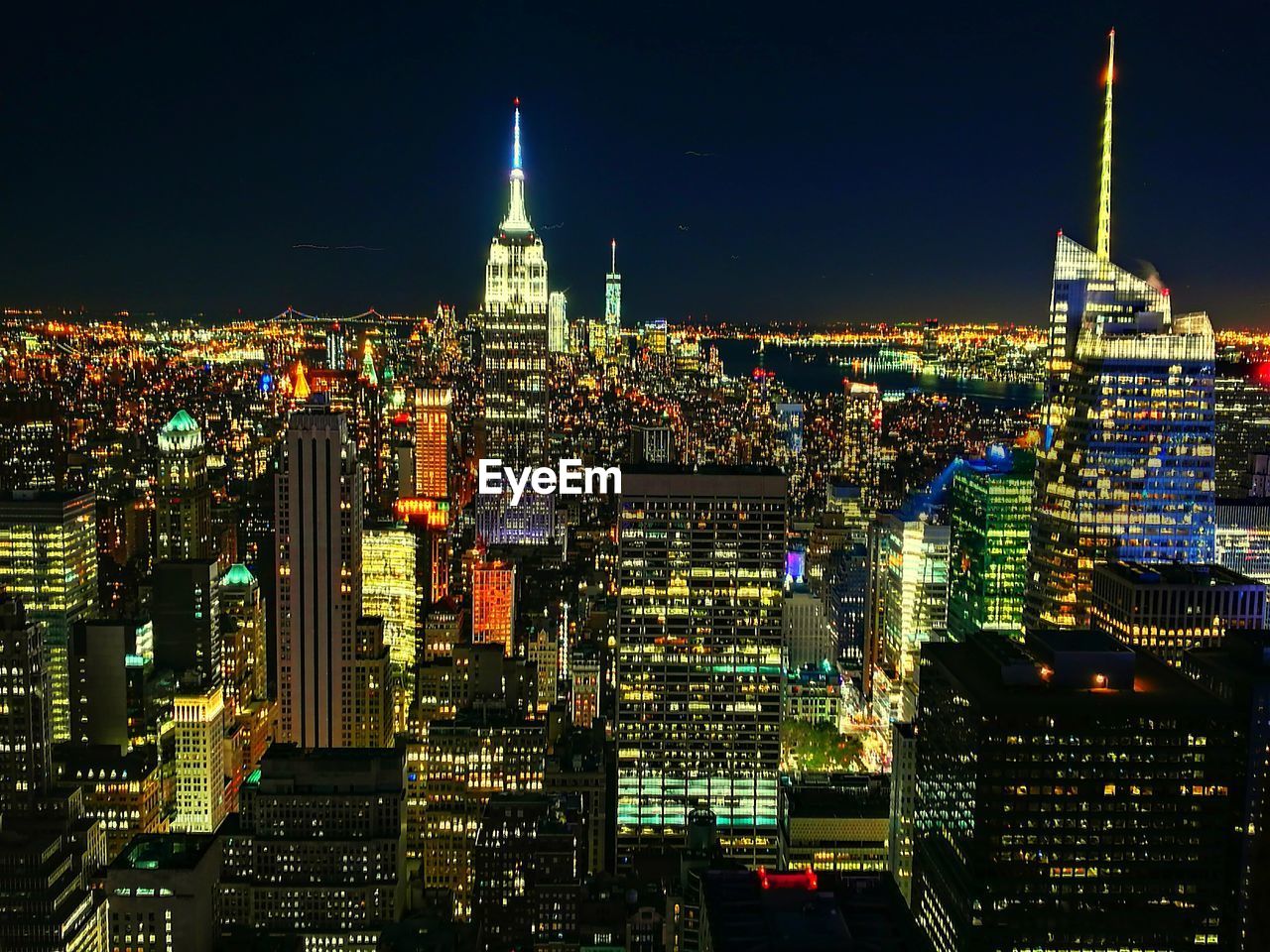 Aerial view of illuminated city at night