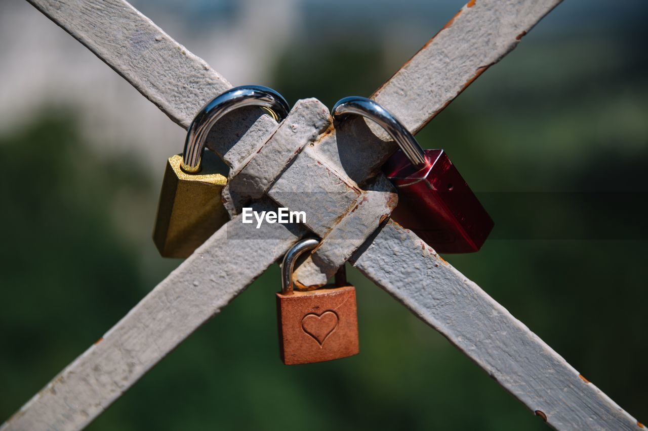 Close-up of love locks on railing