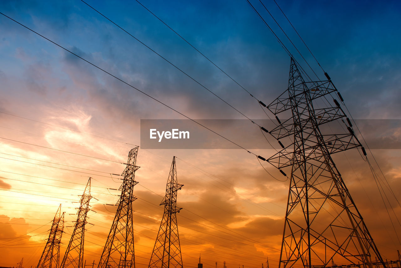 LOW ANGLE VIEW OF SILHOUETTE ELECTRICITY PYLON AGAINST SKY DURING SUNSET