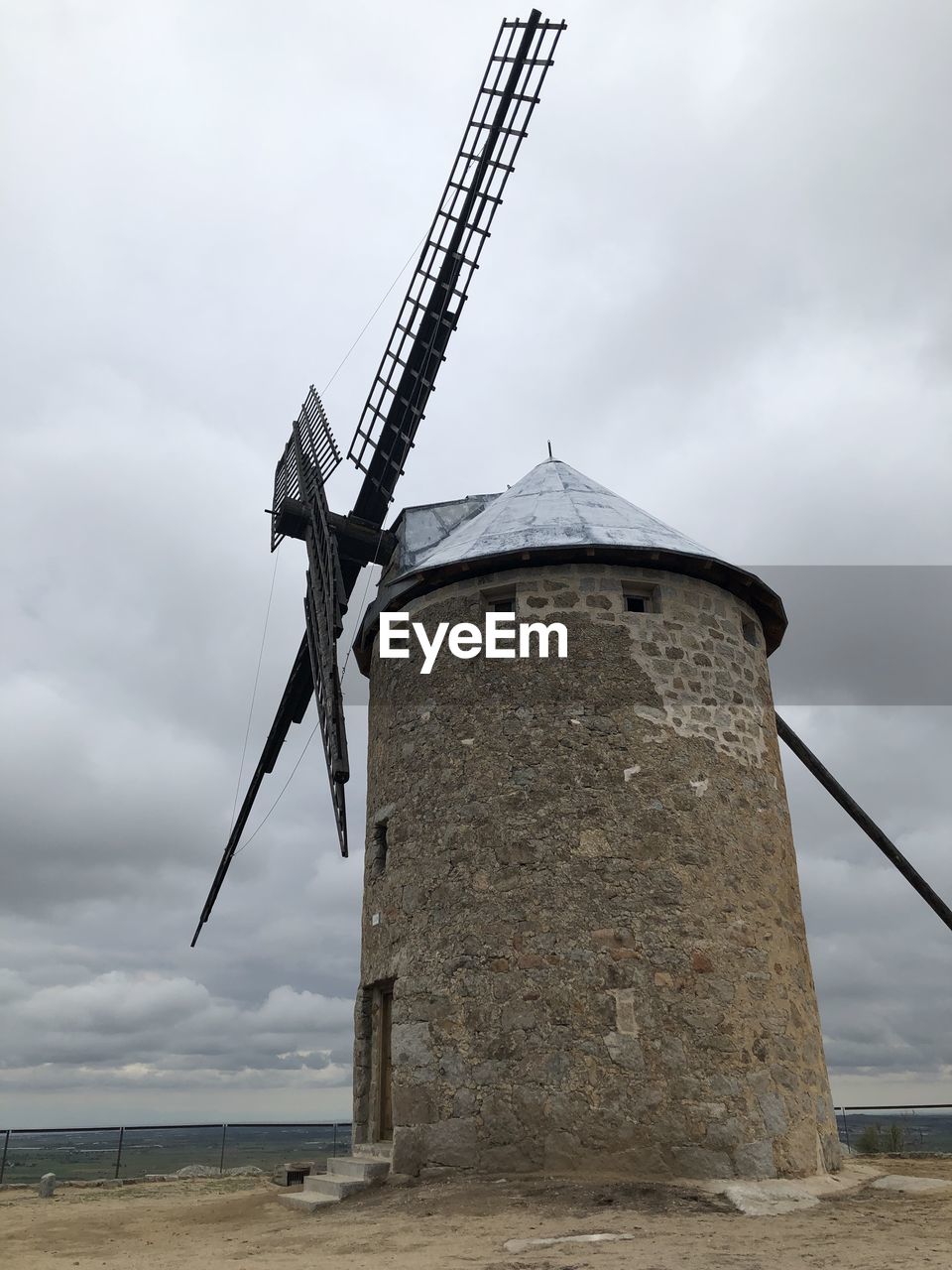 LOW ANGLE VIEW OF TRADITIONAL WINDMILL AGAINST SKY
