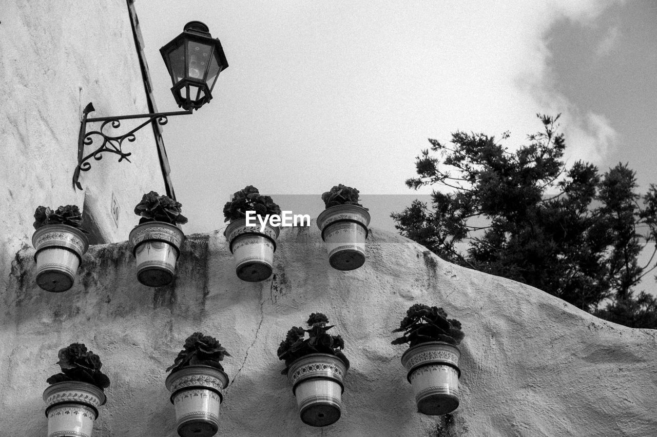 LOW ANGLE VIEW OF STREET LIGHT AGAINST SKY