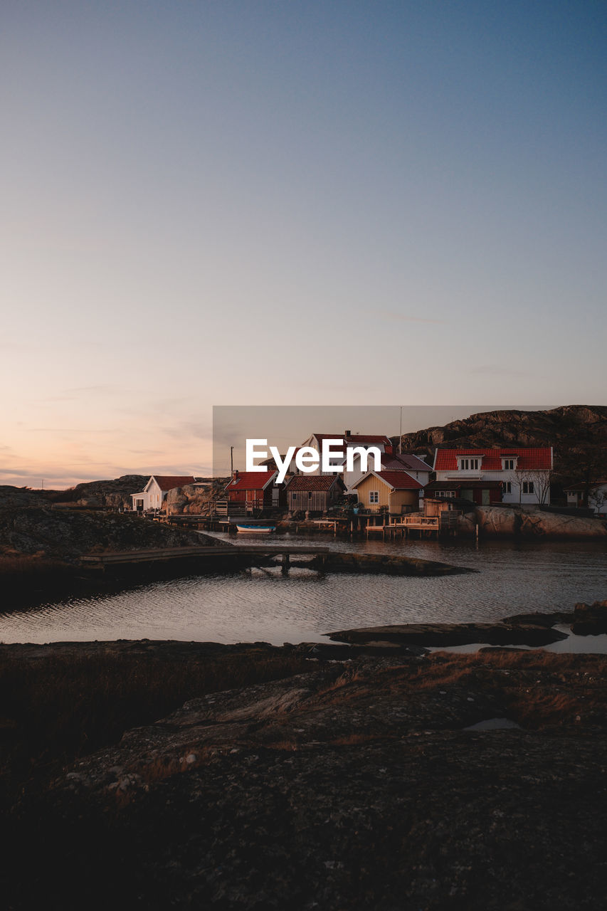 Scenic view of sea against clear sky during sunset