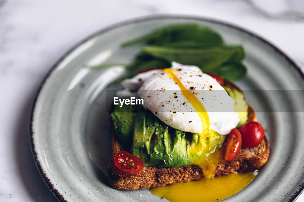 food, food and drink, healthy eating, egg, vegetable, meal, dish, wellbeing, freshness, plate, produce, fried, no people, breakfast, fruit, savory food, poached, fried egg, egg yolk, indoors, green, bread, spinach, close-up, toasted bread