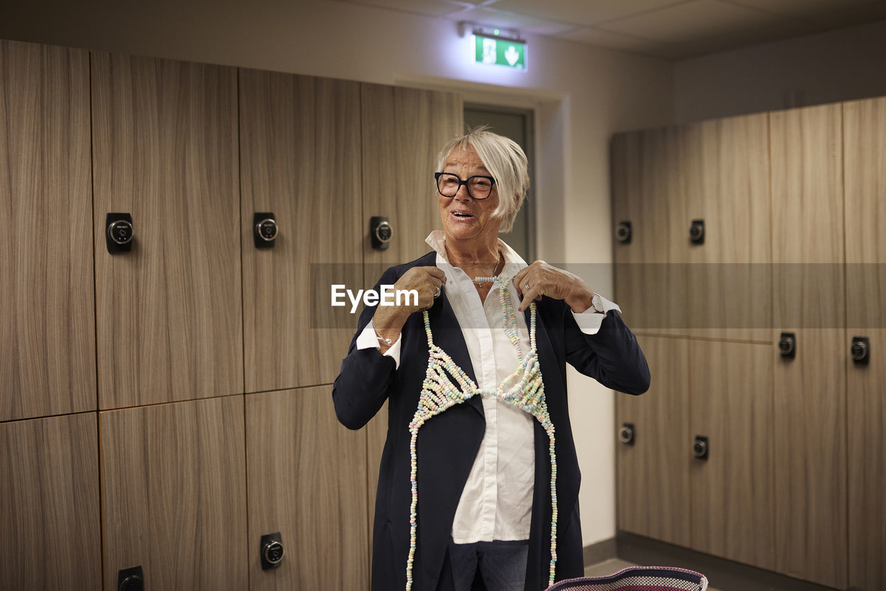 Senior woman in locker room