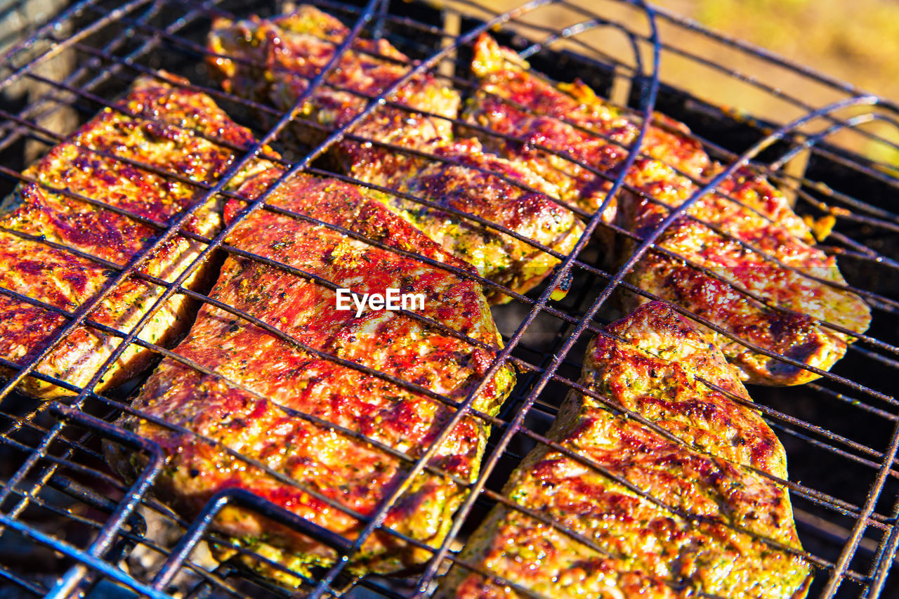 High angle view of meat on barbecue grill