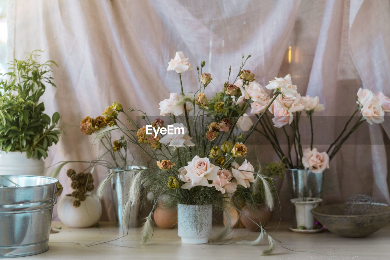 Flower arrangement in vase on table