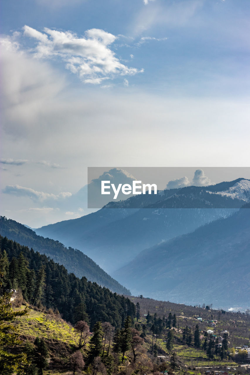 Scenic view of snowcapped mountains against sky