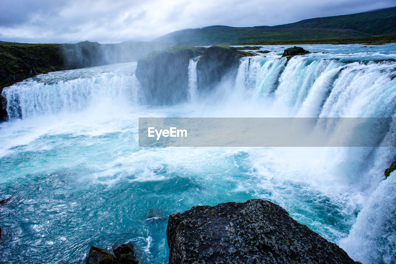 Waterfall godafoss with blue water in iceland. landscape.