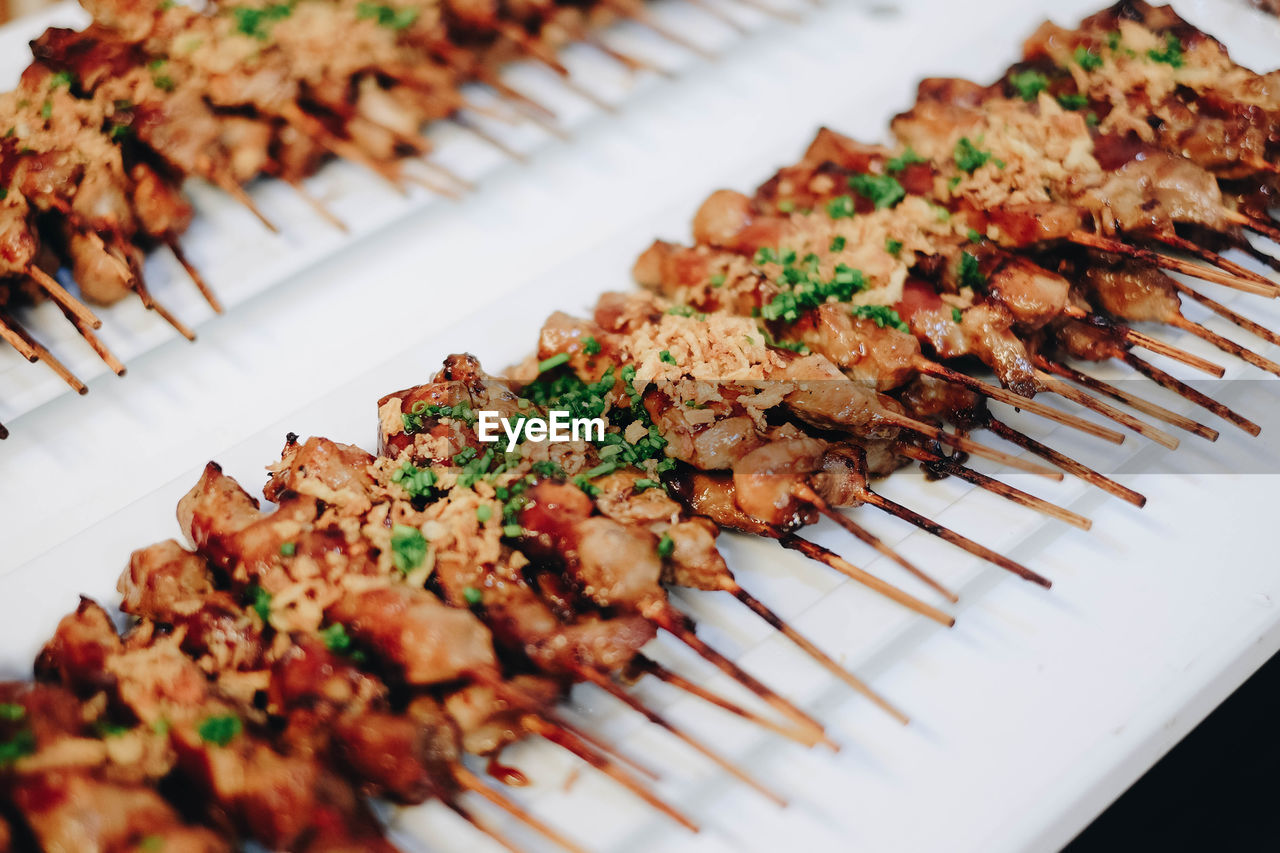 High angle view of meat skewers on plate