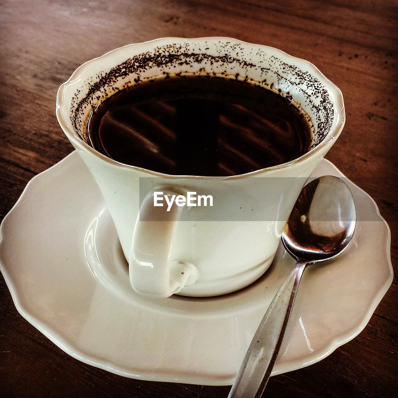 Close-up of black coffee cup on table