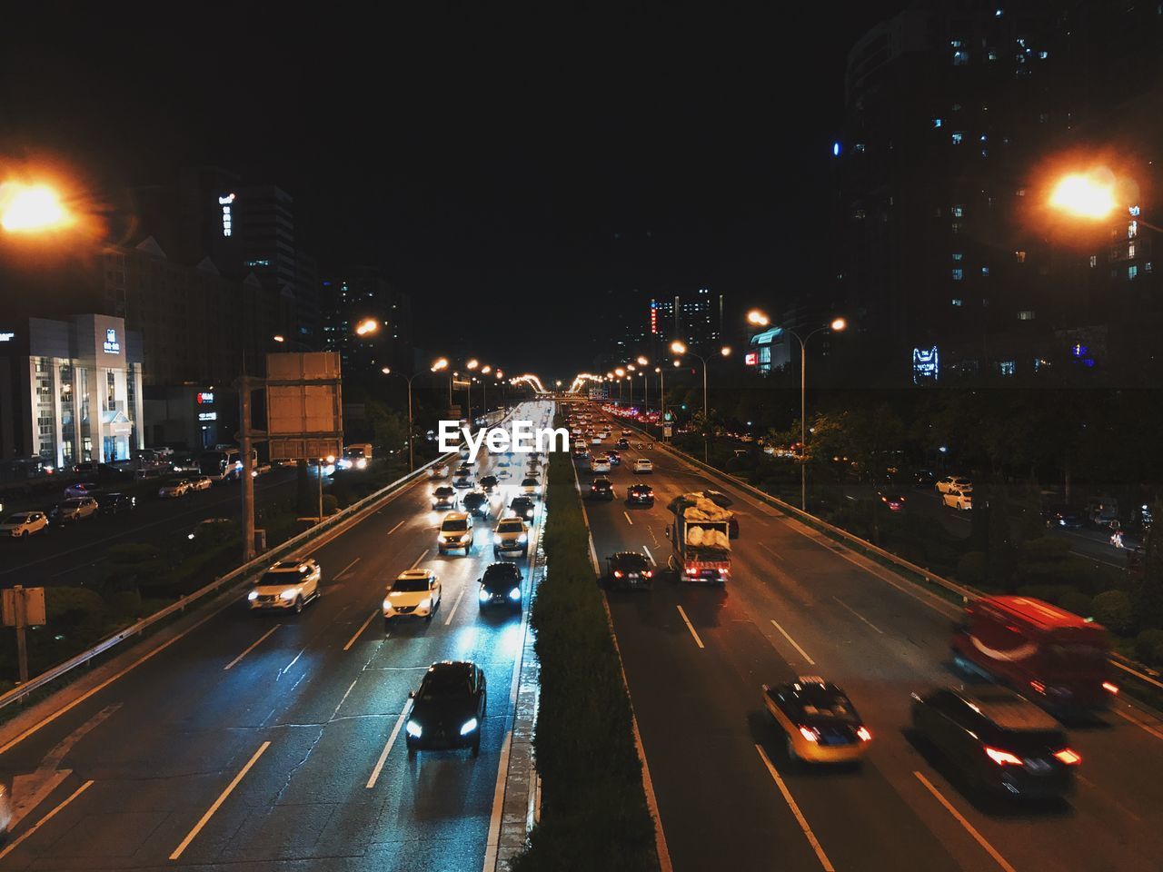 High angle view of traffic on city street at night