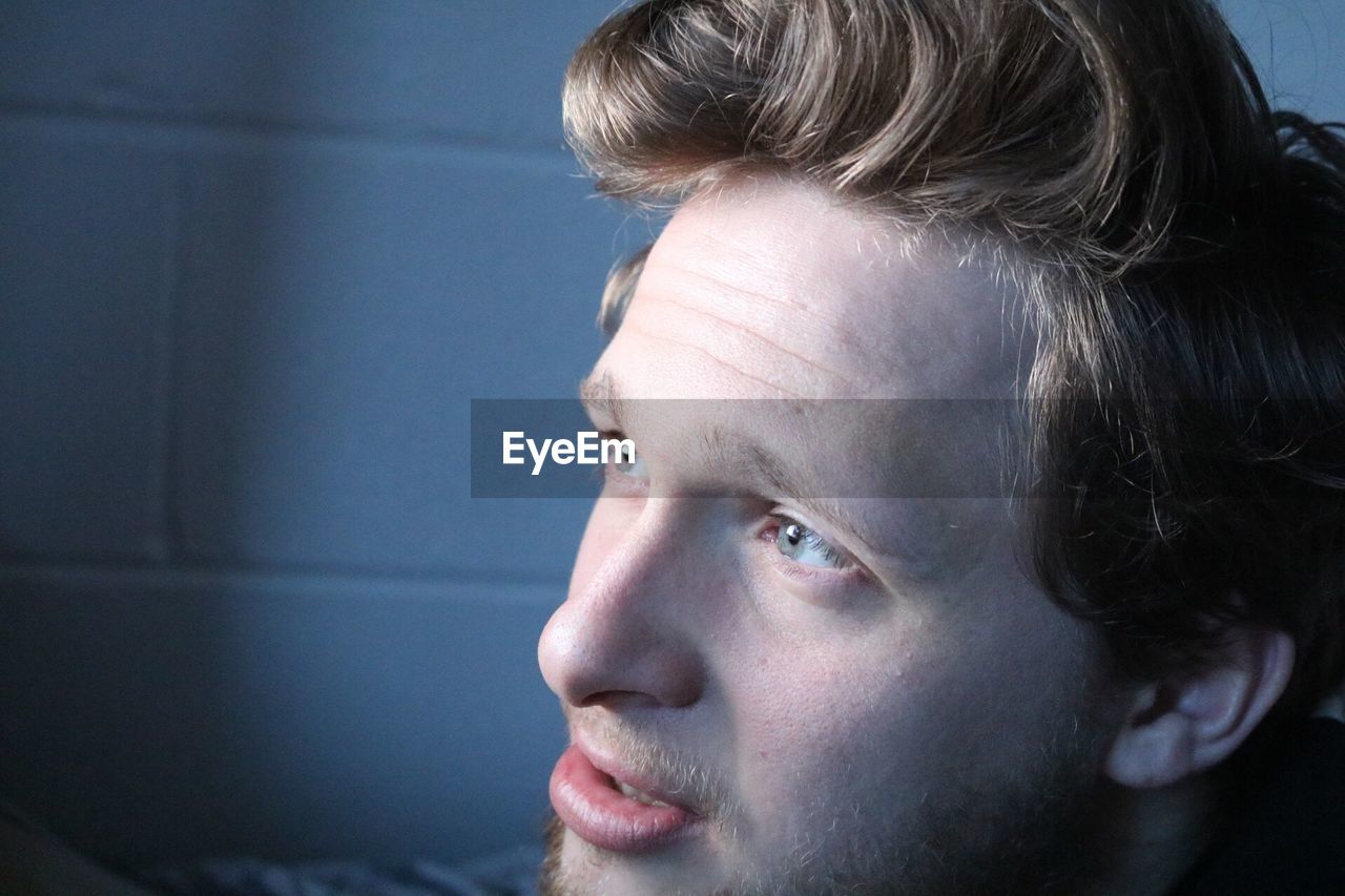 Close-up of young man looking away