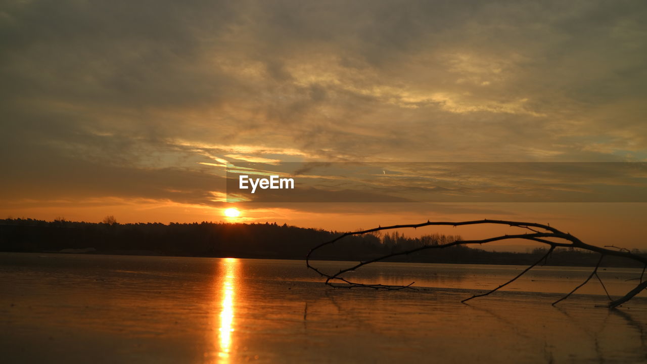 SCENIC VIEW OF DRAMATIC SKY DURING SUNSET