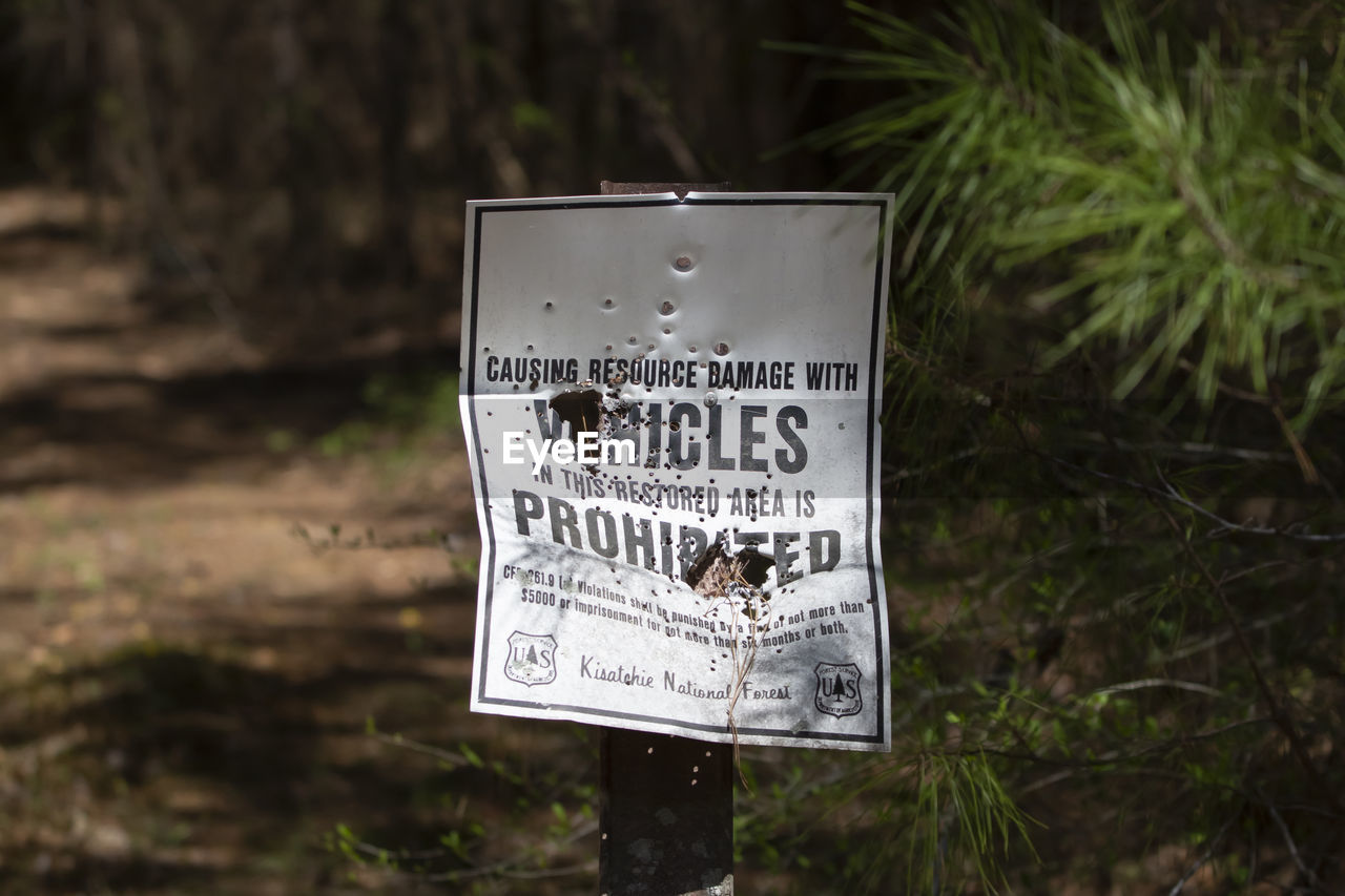 close-up of information sign on field