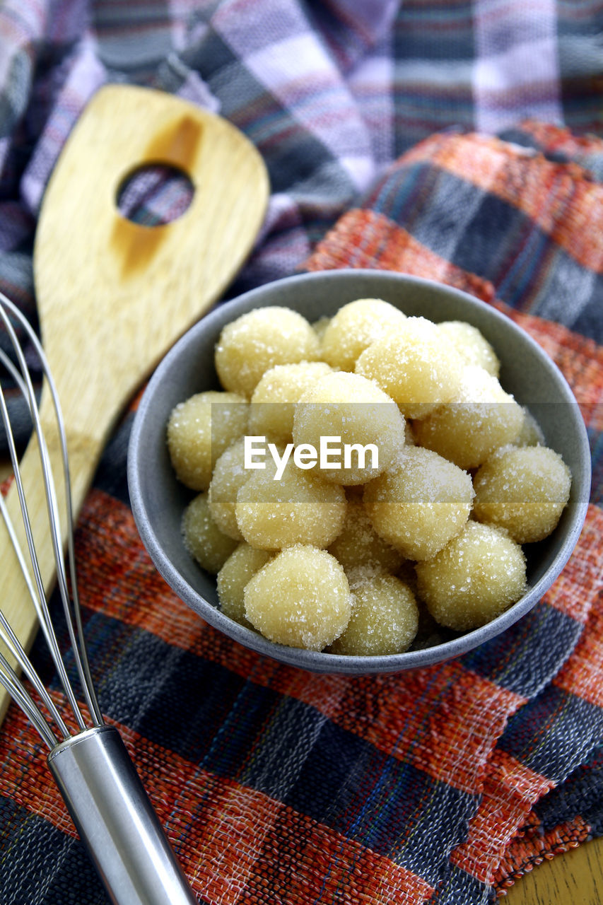 Photo of freshly made pastillas de patatas or candy balls made out of potato, milk and sugar