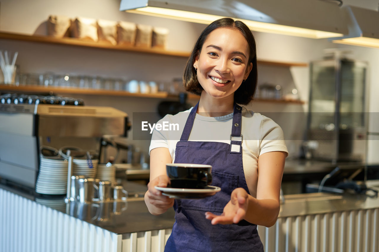 portrait of young woman using phone