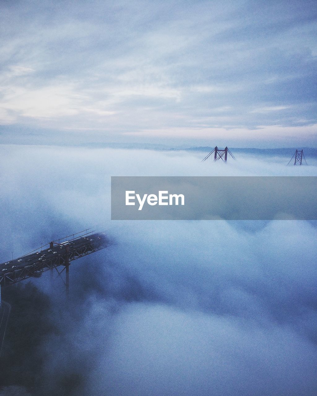 High angle view of bridge amidst cloudscape