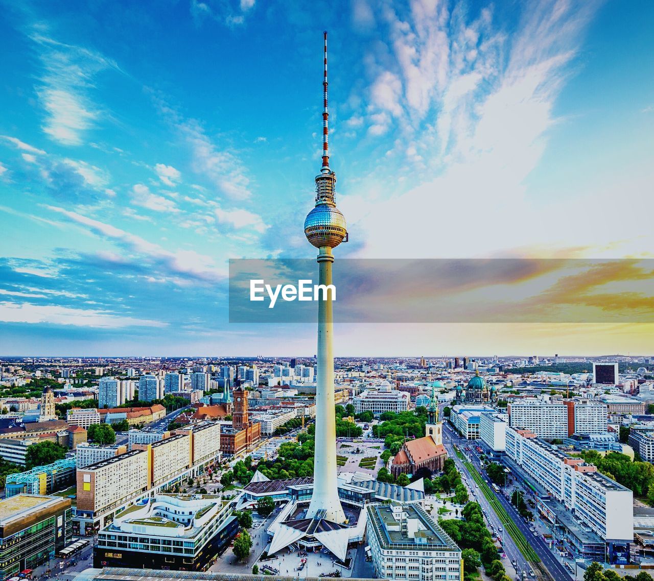 High angle view of communications tower and buildings in city