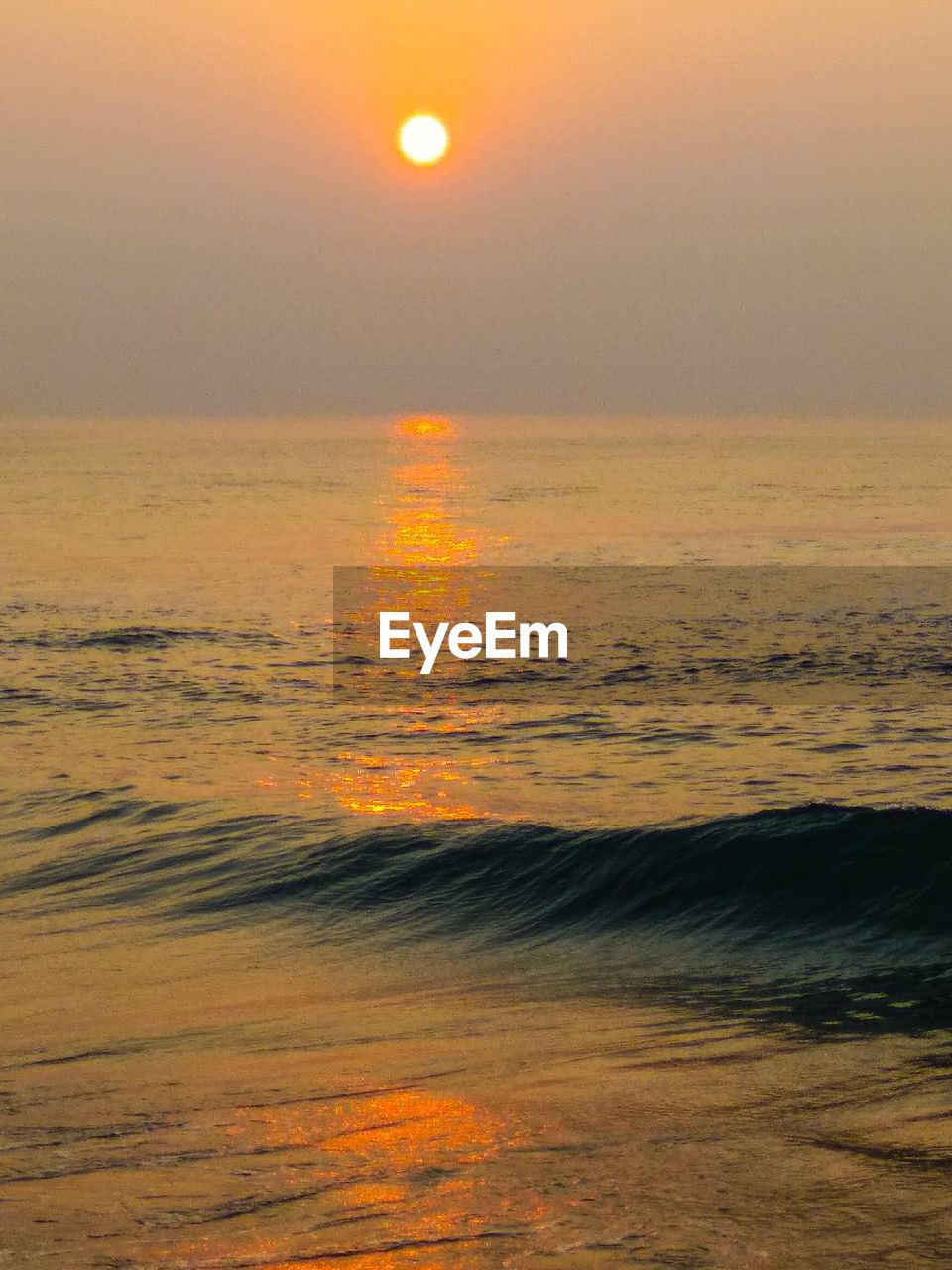 SCENIC VIEW OF BEACH AGAINST SKY DURING SUNSET