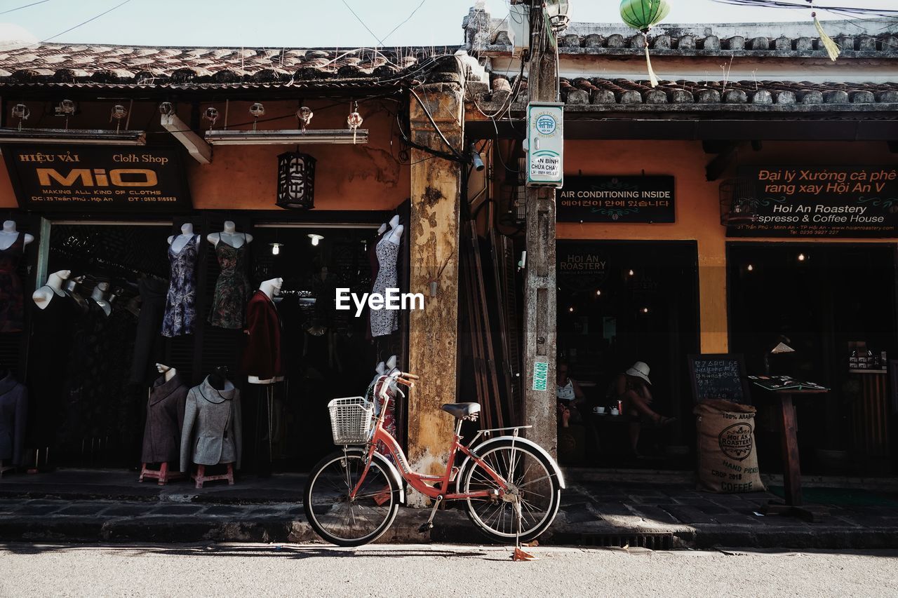 BICYCLES ON STREET AGAINST BUILDING