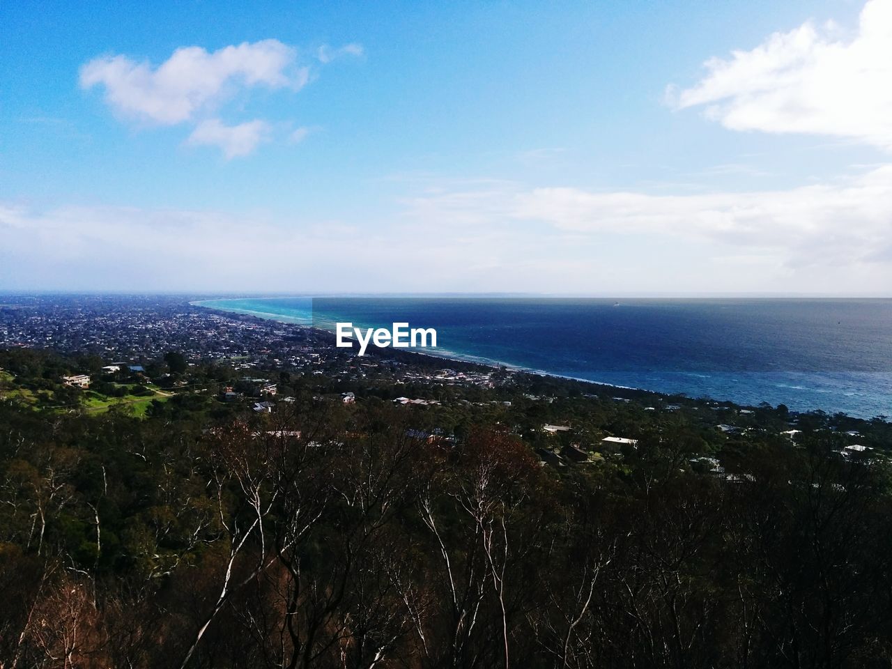 High angle view of landscape against calm sea