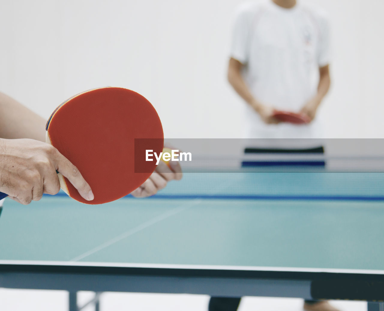 People playing table tennis