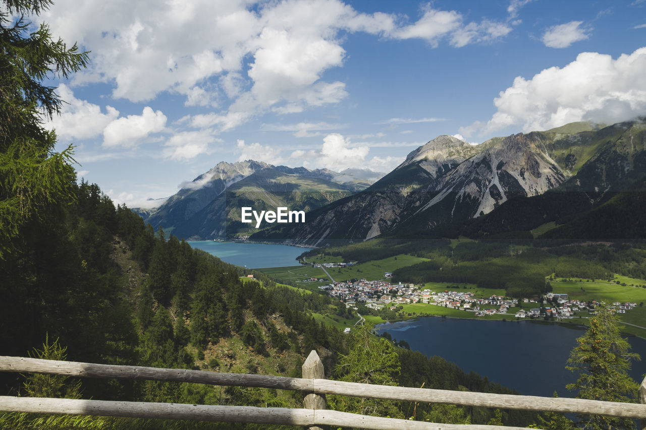 Scenic view of lake and mountains against sky