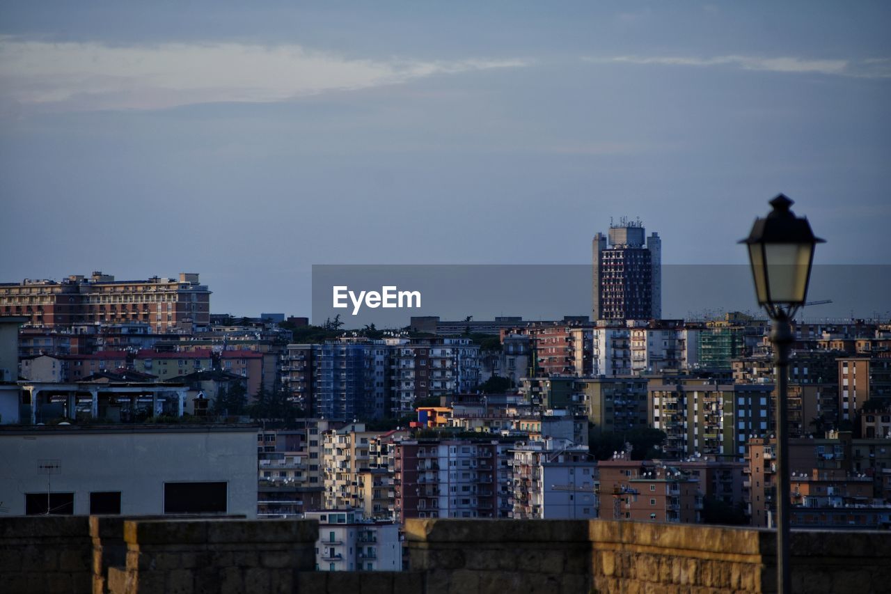 Buildings in city at dusk